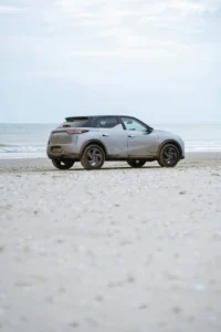 Small SUV on the beach.