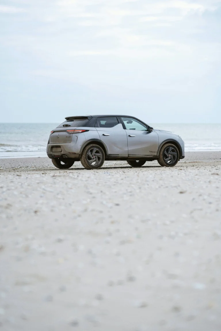 Small SUV on the beach.
