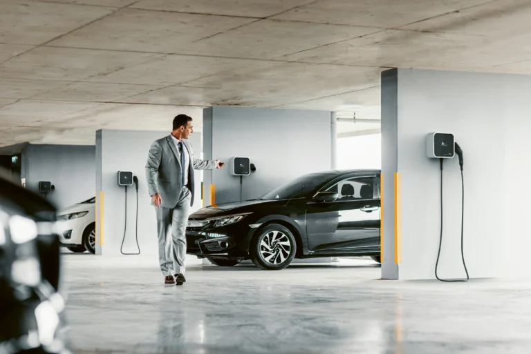Man in Suit Walking Towards Car